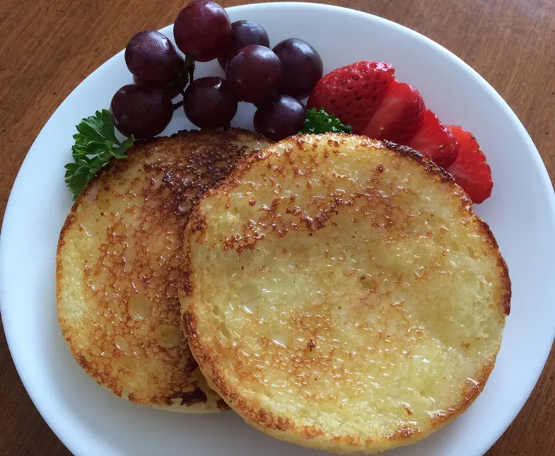 Photo of a toasted glutino gluten free english muffin with fruit 